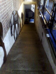 Sloping ramp with walls to the sides descends into distance