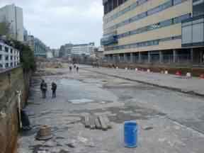 Paddington Basin, 27-2-2000, drained with people walking in it.