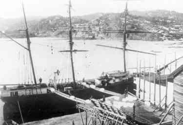 Ship loading - ice is sliding along awooden slide to the ship