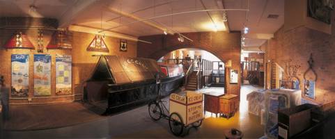 A panorama shot of the ground floor of the museum with narrowboat to rear and exhibitis to the fore