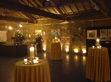 First floor, small tall tables set out for reception