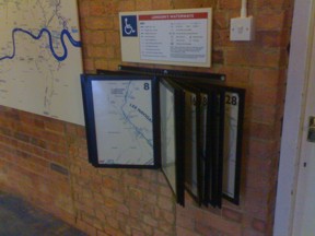 Map in sections on swinging frames at low level